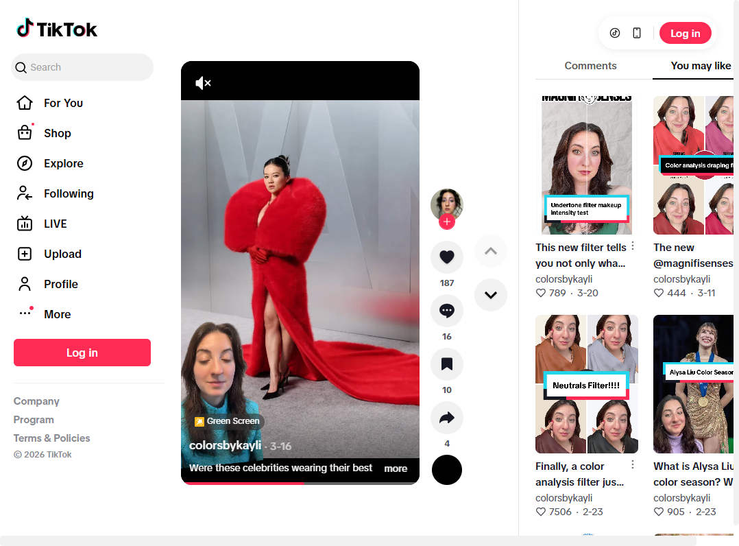 Celebrity in a bold red gown with large fur shoulders at the Oscars