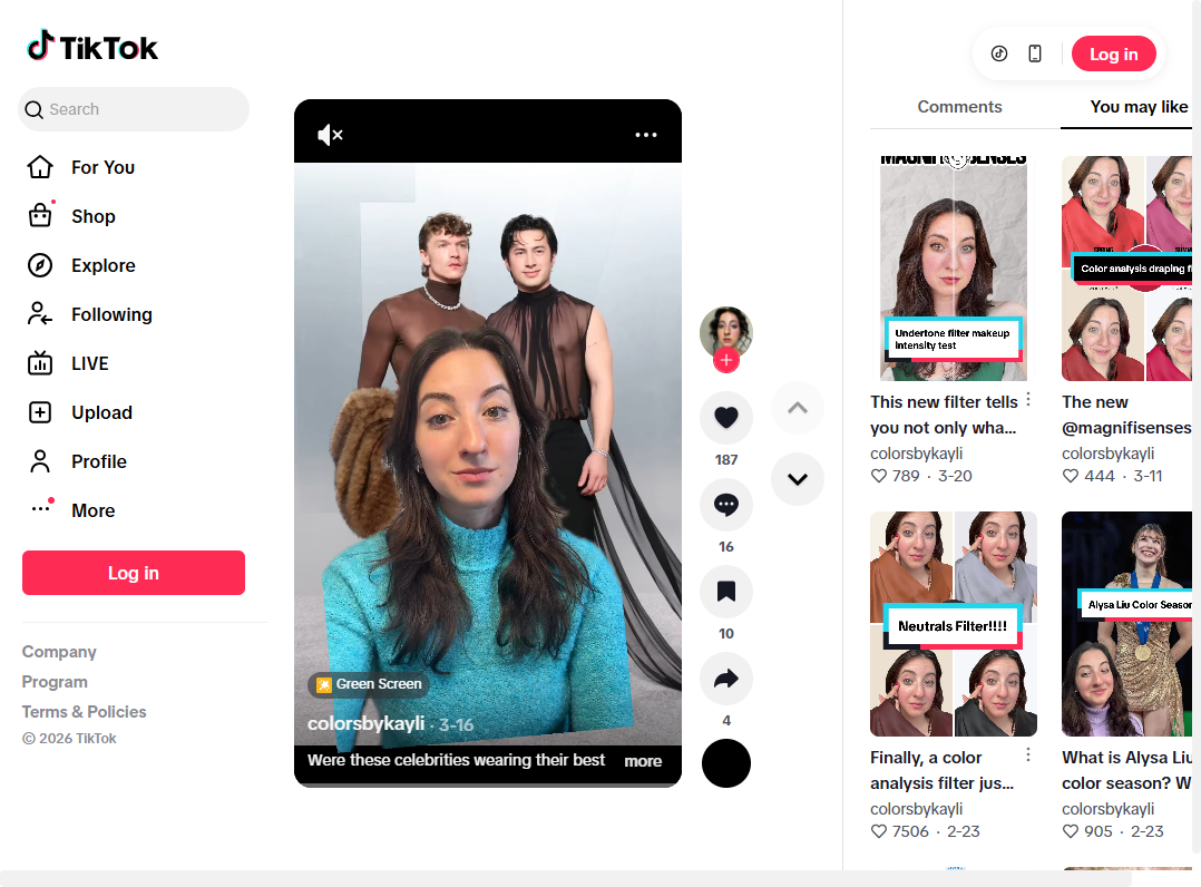 Two men at the Oscars after party, one in a sheer black top and one holding a brown fur coat